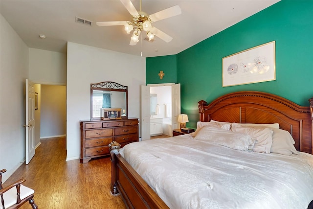 203 Millington Trl, Mansfield, TX 76063 - bedroom featuring wood finished floors, baseboards, a ceiling fan, and ensuite bathroom