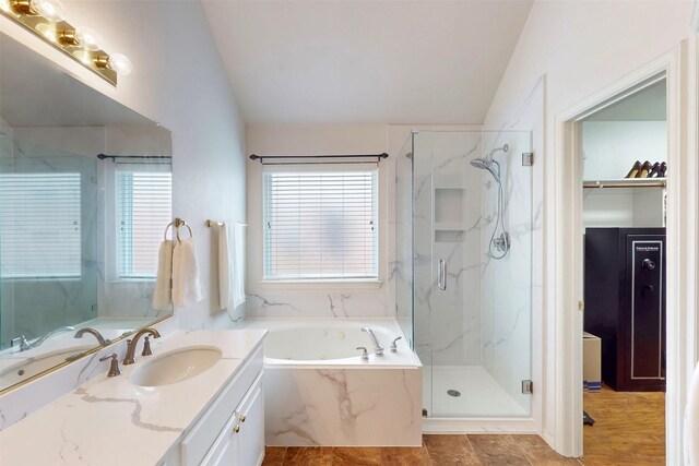 203 Millington Trl, Mansfield, TX 76063 - bathroom with vaulted ceiling, a marble finish shower, a garden tub, and vanity