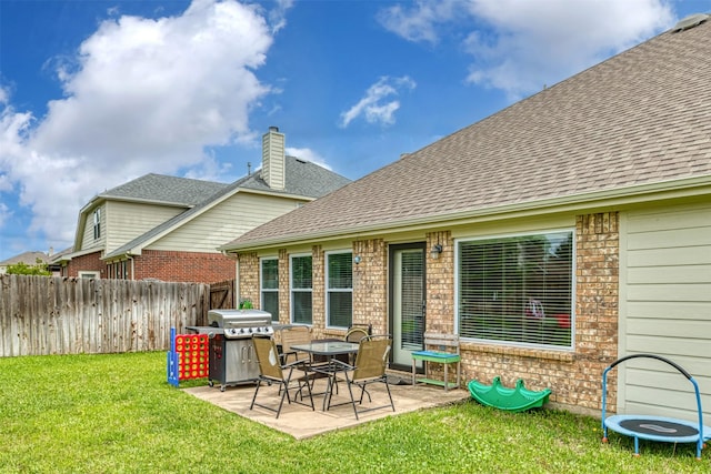 203 Millington Trl, Mansfield, TX 76063 - rear view of house featuring brick siding, a patio area, roof with shingles, and a chimney