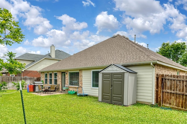 203 Millington Trl, Mansfield, TX 76063 - rear view of property with a storage shed, a patio area, roof with shingles, and brick siding