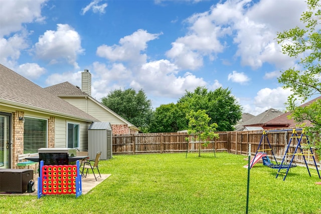 203 Millington Trl, Mansfield, TX 76063 - view of yard featuring a storage unit, an outbuilding, a playground, and a patio
