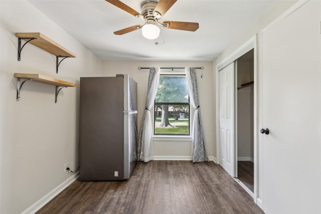 7613 Hewitt St, North Richland Hills, TX 76182 - unfurnished bedroom featuring freestanding refrigerator, wood finished floors, baseboards, and a ceiling fan