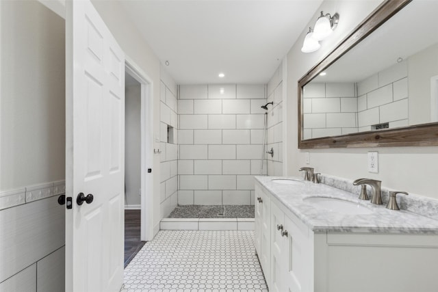 7613 Hewitt St, North Richland Hills, TX 76182 - full bathroom featuring tiled shower, double vanity, recessed lighting, and tile patterned flooring