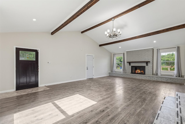 7613 Hewitt St, North Richland Hills, TX 76182 - unfurnished living room featuring a chandelier, wood finished floors, a brick fireplace, and baseboards