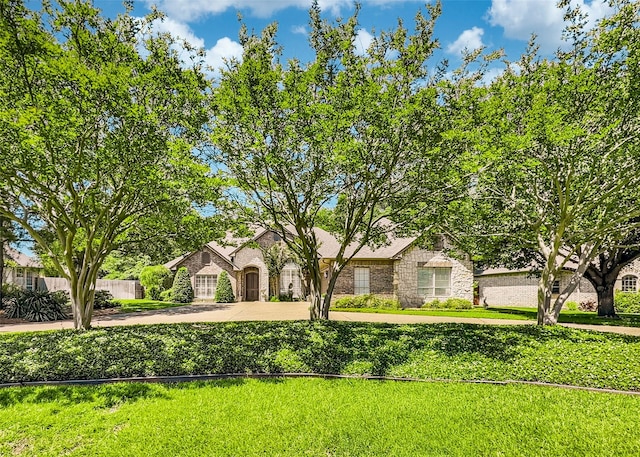 2215 Firestone Cir, Tyler, TX 75703 - view of front of house with stone siding and a front yard