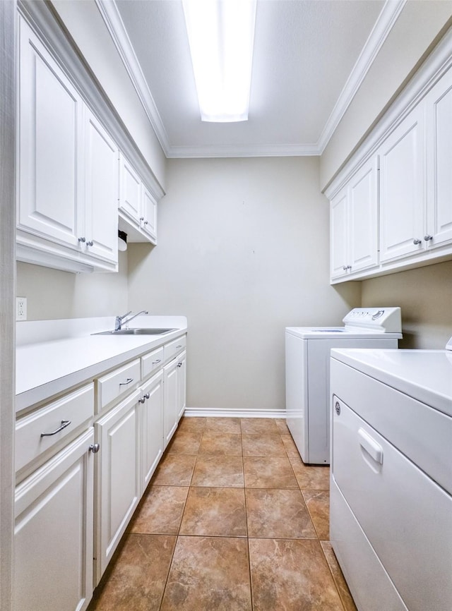 2215 Firestone Cir, Tyler, TX 75703 - laundry room with cabinet space, separate washer and dryer, ornamental molding, and baseboards