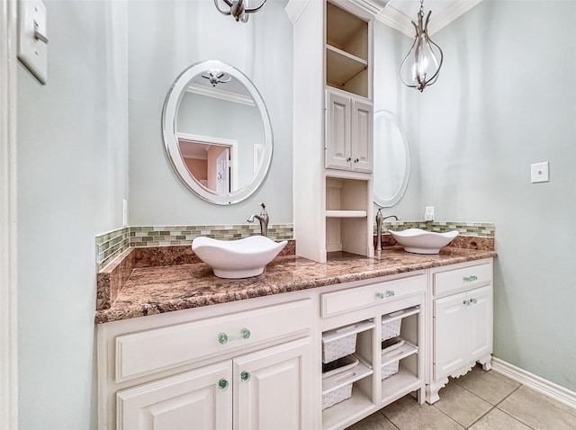 2215 Firestone Cir, Tyler, TX 75703 - full bathroom featuring tile patterned flooring, double vanity, tasteful backsplash, crown molding, and a chandelier