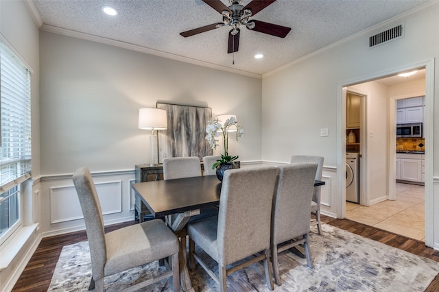 605 Keel Way, Azle, TX 76020 - dining area with light wood-style flooring, washer / dryer, a ceiling fan, a wainscoted wall, and recessed lighting