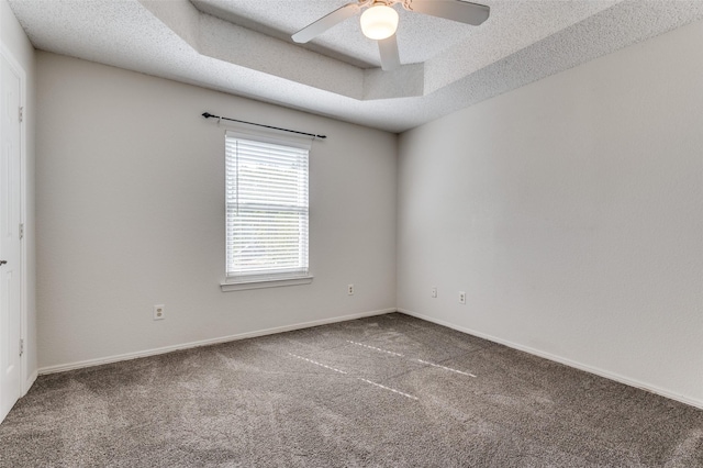 605 Keel Way, Azle, TX 76020 - spare room featuring carpet, a ceiling fan, baseboards, a textured ceiling, and a raised ceiling