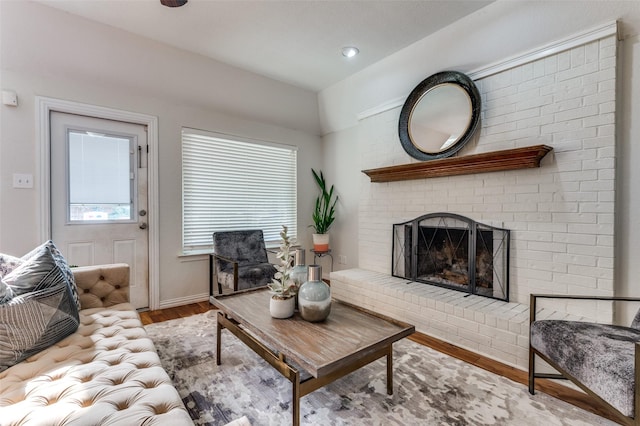 605 Keel Way, Azle, TX 76020 - living area featuring wood finished floors, a fireplace, and baseboards