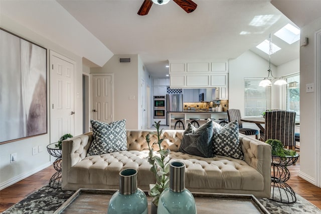 605 Keel Way, Azle, TX 76020 - living area with a skylight, a ceiling fan, lofted ceiling, wood finished floors, and baseboards