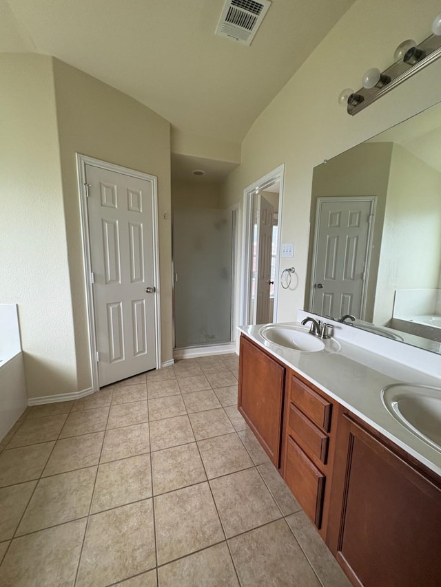 10237 Marigold Rd, Waco, TX 76708 - bathroom with a shower stall, tile patterned flooring, a garden tub, and double vanity