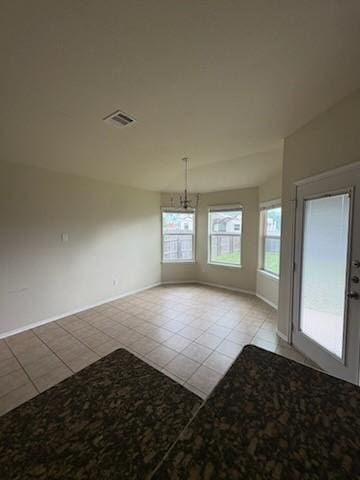 10237 Marigold Rd, Waco, TX 76708 - unfurnished dining area with light tile patterned floors and baseboards