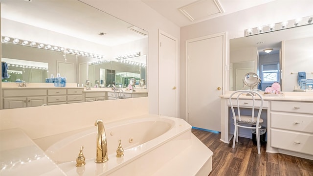 4536 Overlook Ct, Granbury, TX 76049 - full bath with wood finished floors, a tub with jets, and vanity