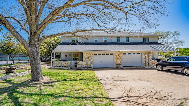 4536 Overlook Ct, Granbury, TX 76049 - view of front facade featuring stone siding, covered porch, a garage, concrete driveway, and roof with shingles
