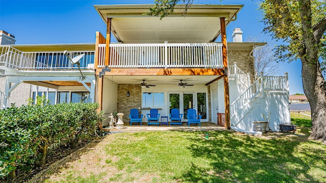 4536 Overlook Ct, Granbury, TX 76049 - rear view of property featuring ceiling fan, stairway, a lawn, a chimney, and brick siding