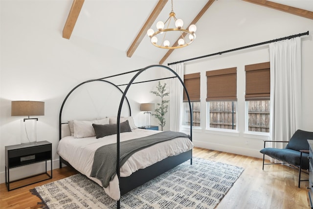 bedroom featuring a chandelier, beam ceiling, wood finished floors, baseboards, and high vaulted ceiling