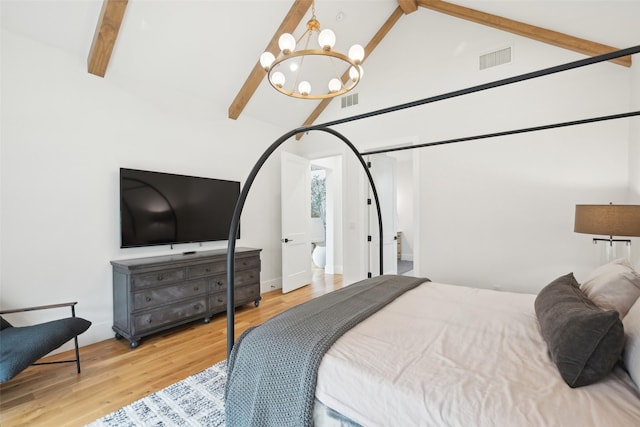 bedroom featuring a chandelier, beamed ceiling, light wood-style floors, and high vaulted ceiling