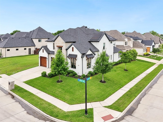 view of front facade featuring a standing seam roof, driveway, a residential view, a front lawn, and stucco siding