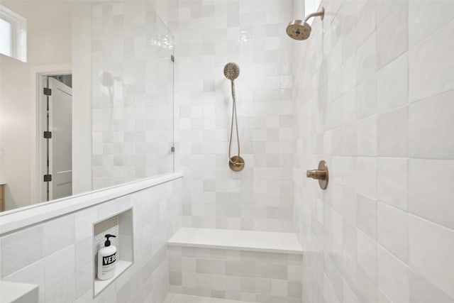 bathroom with tiled shower