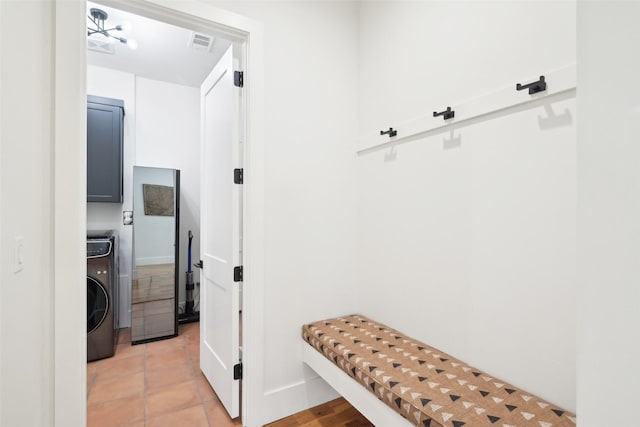 mudroom featuring washer / dryer and baseboards