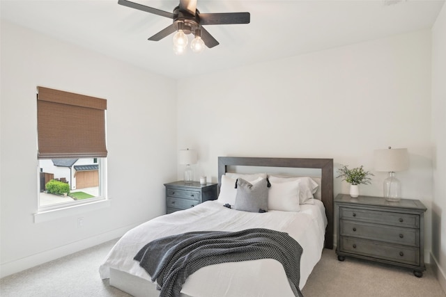 bedroom featuring carpet floors, baseboards, and a ceiling fan