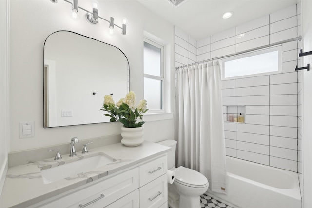 bathroom featuring plenty of natural light, toilet, shower / bath combo, vanity, and recessed lighting