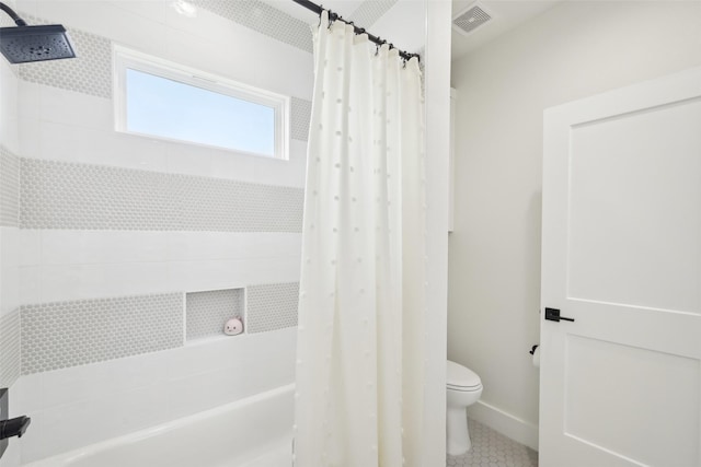 full bathroom with toilet, shower / tub combo, and tile patterned flooring