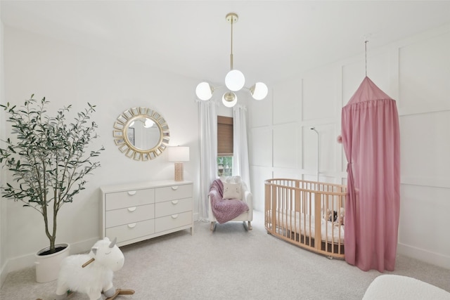 bedroom with carpet floors and a nursery area