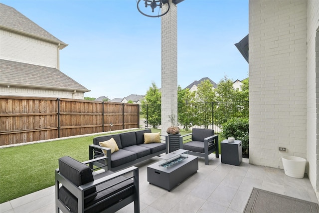 view of patio / terrace featuring an outdoor living space with a fire pit