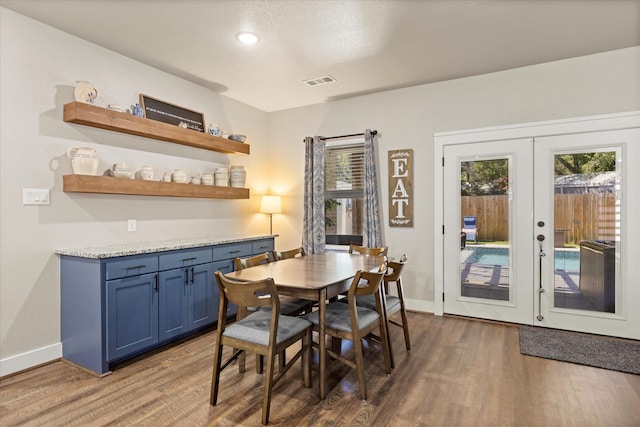 2610 Austin Dr, Granbury, TX 76048 - dining space with dark wood-style floors, baseboards, french doors, and recessed lighting