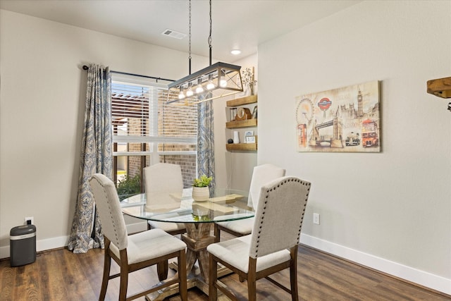 2610 Austin Dr, Granbury, TX 76048 - dining room with baseboards, wood finished floors, and a chandelier