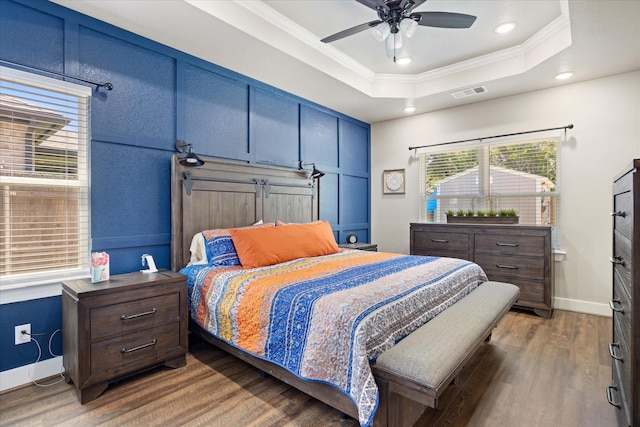 2610 Austin Dr, Granbury, TX 76048 - bedroom with ornamental molding, wood finished floors, a tray ceiling, recessed lighting, and baseboards