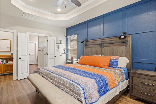 2610 Austin Dr, Granbury, TX 76048 - bedroom featuring a tray ceiling, crown molding, dark wood-type flooring, a ceiling fan, and recessed lighting