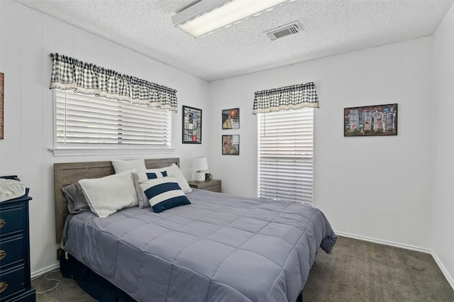 805 Sandpiper Dr, Denton, TX 76205 - carpeted bedroom featuring multiple windows, a textured ceiling, and baseboards