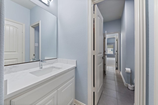14322 Summerwoods Ln, Frisco, TX 75035 - bathroom featuring tile patterned flooring, vanity, and a textured wall