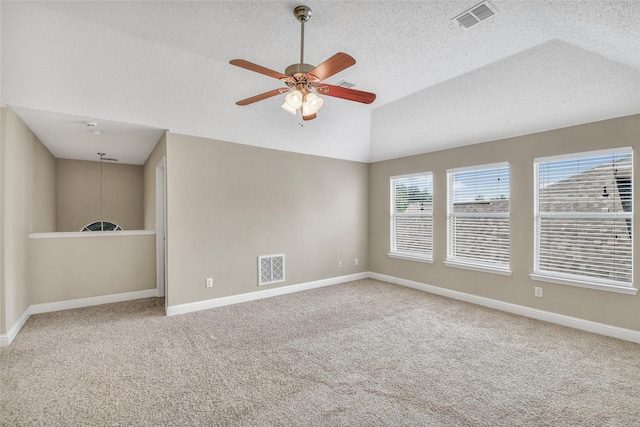 207 Trailwood Dr, Allen, TX 75002 - carpeted spare room featuring ceiling fan, a textured ceiling, vaulted ceiling, and baseboards