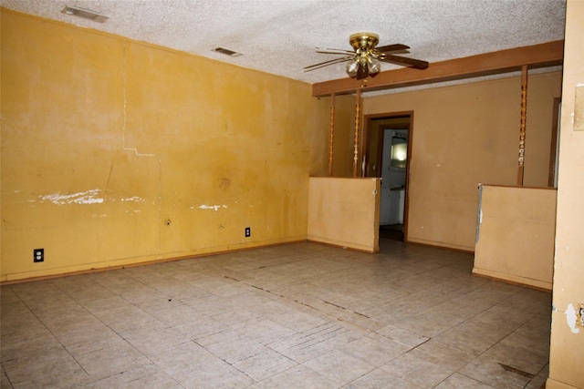 6645 Onyx Dr N, North Richland Hills, TX 76180 - spare room with ceiling fan and a textured ceiling
