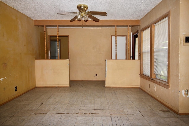 6645 Onyx Dr N, North Richland Hills, TX 76180 - unfurnished room with a ceiling fan, a textured ceiling, and baseboards