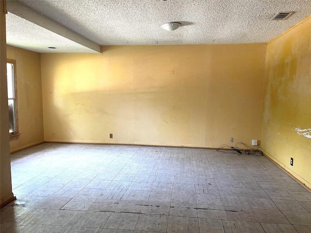 6645 Onyx Dr N, North Richland Hills, TX 76180 - unfurnished room featuring a textured ceiling and baseboards