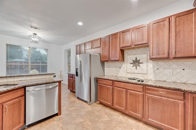 2904 Champlin Ct, Richardson, TX 75082 - kitchen with appliances with stainless steel finishes, backsplash, light stone countertops, brown cabinets, and recessed lighting