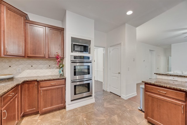 2904 Champlin Ct, Richardson, TX 75082 - kitchen featuring stainless steel appliances, light stone countertops, decorative backsplash, and brown cabinetry