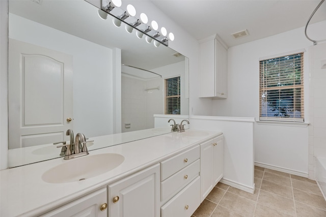 2904 Champlin Ct, Richardson, TX 75082 - full bath featuring double vanity, tile patterned flooring, and baseboards