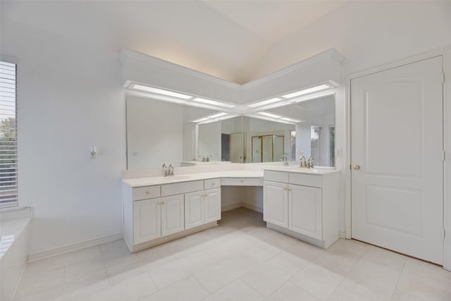 2904 Champlin Ct, Richardson, TX 75082 - bathroom with vanity, vaulted ceiling, a bathtub, tile patterned flooring, and baseboards