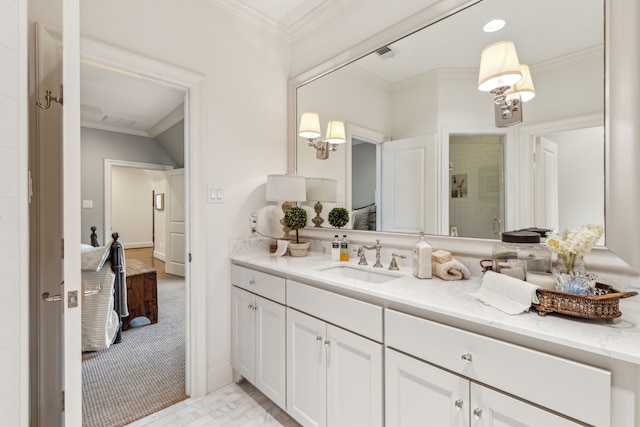 bathroom featuring a stall shower, vanity, and crown molding