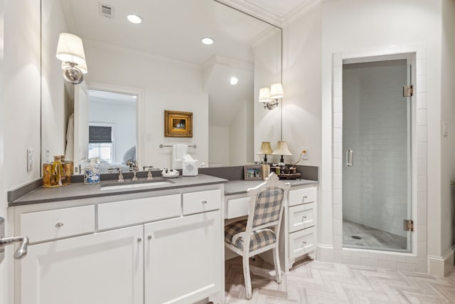 ensuite bathroom featuring a shower stall, vanity, ornamental molding, and recessed lighting