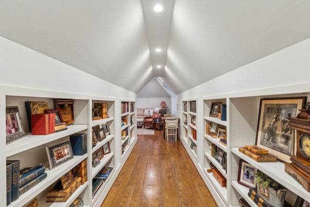 sitting room with built in features, lofted ceiling, wood finished floors, and recessed lighting