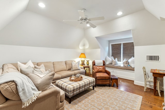 living room featuring vaulted ceiling, wood finished floors, ceiling fan, recessed lighting, and baseboards
