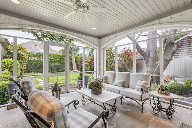 sunroom with ceiling fan and an outdoor hangout area