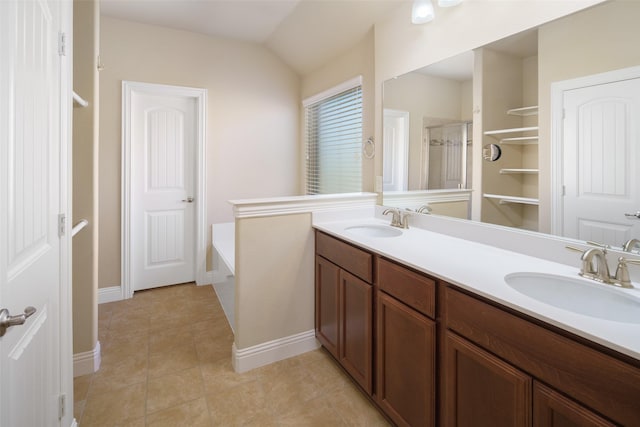 609 Racine Dr, Oak Point, TX 75068 - full bath featuring double vanity, a bath, tile patterned flooring, and baseboards